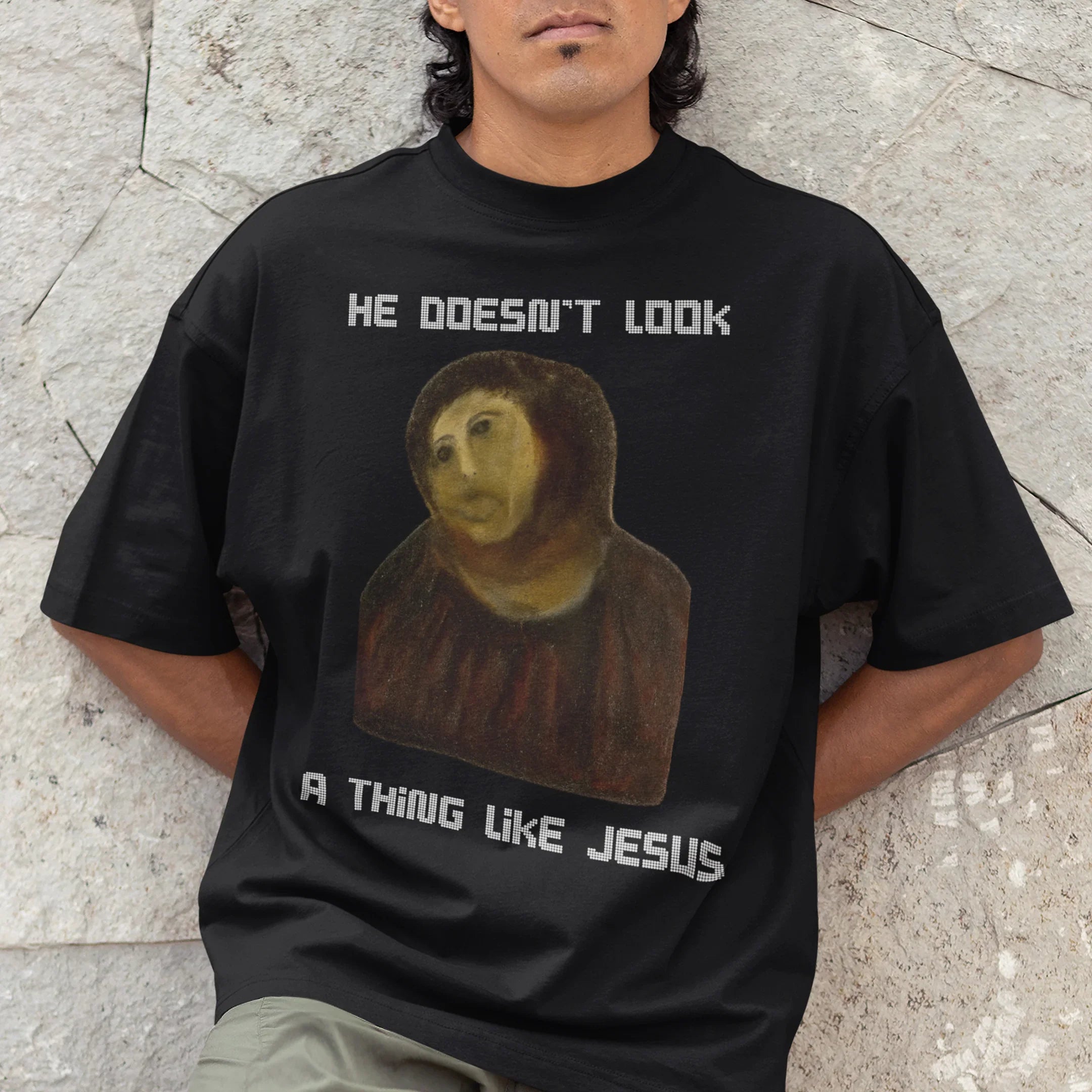 He doesn't look a thing like Jesus T-Shirt - Orbital Clothing
