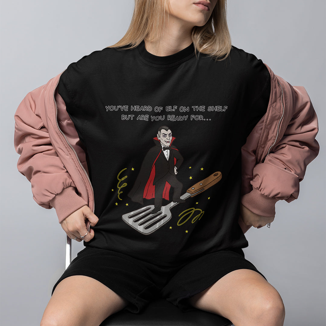 You've heard of elf on the shelf but are you ready for Dracula on a Spatula T-Shirt