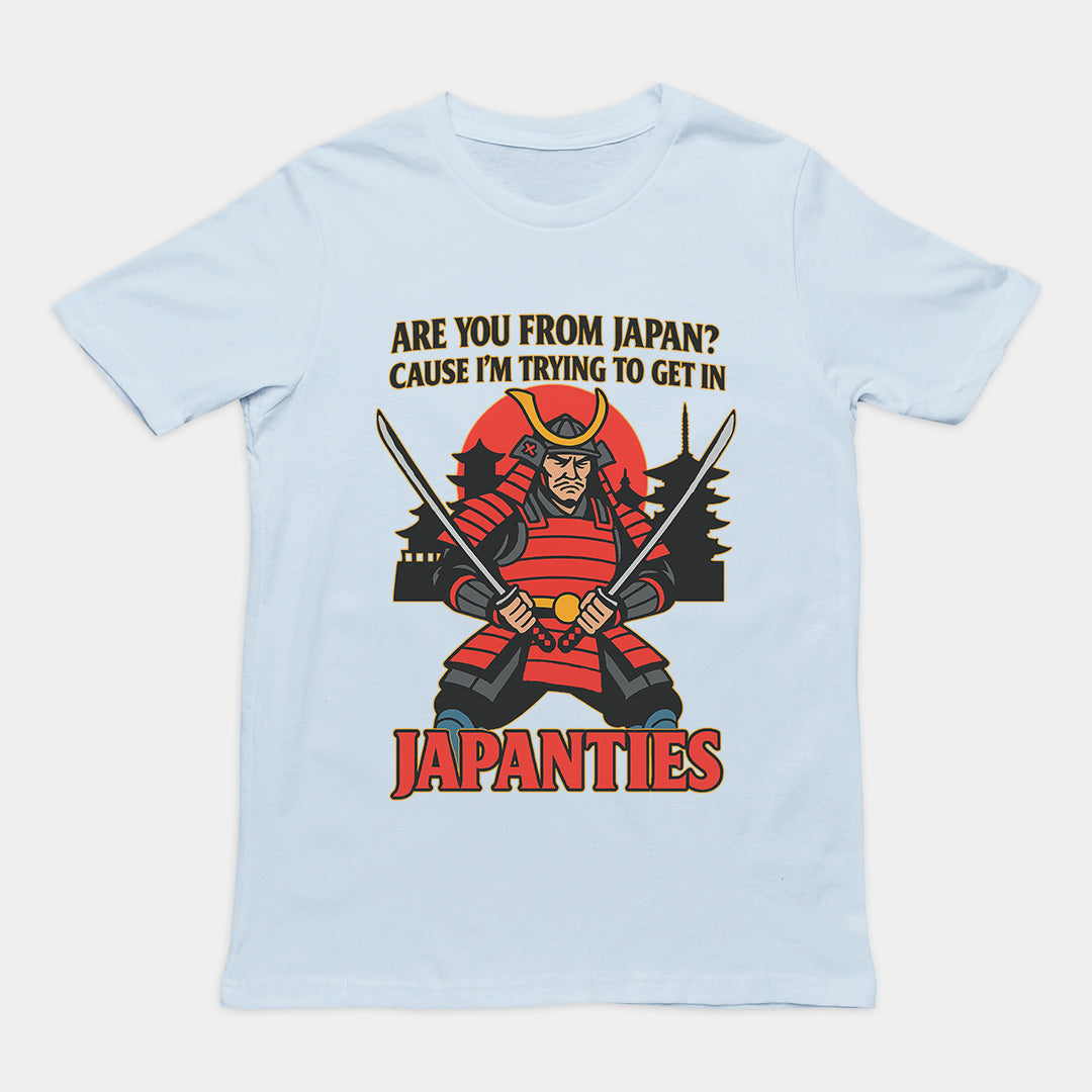 Humorous "Are you from Japan? Cause I'm trying to get in Japanties" pick-up line graphic on a light blue premium t-shirt.