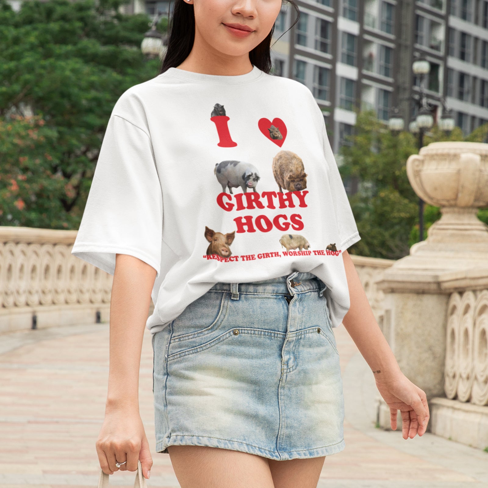 Woman wearing an Orbital Clothing white t-shirt featuring funny graphic text I Love Girthy Hogs with fat hedgehog illustration