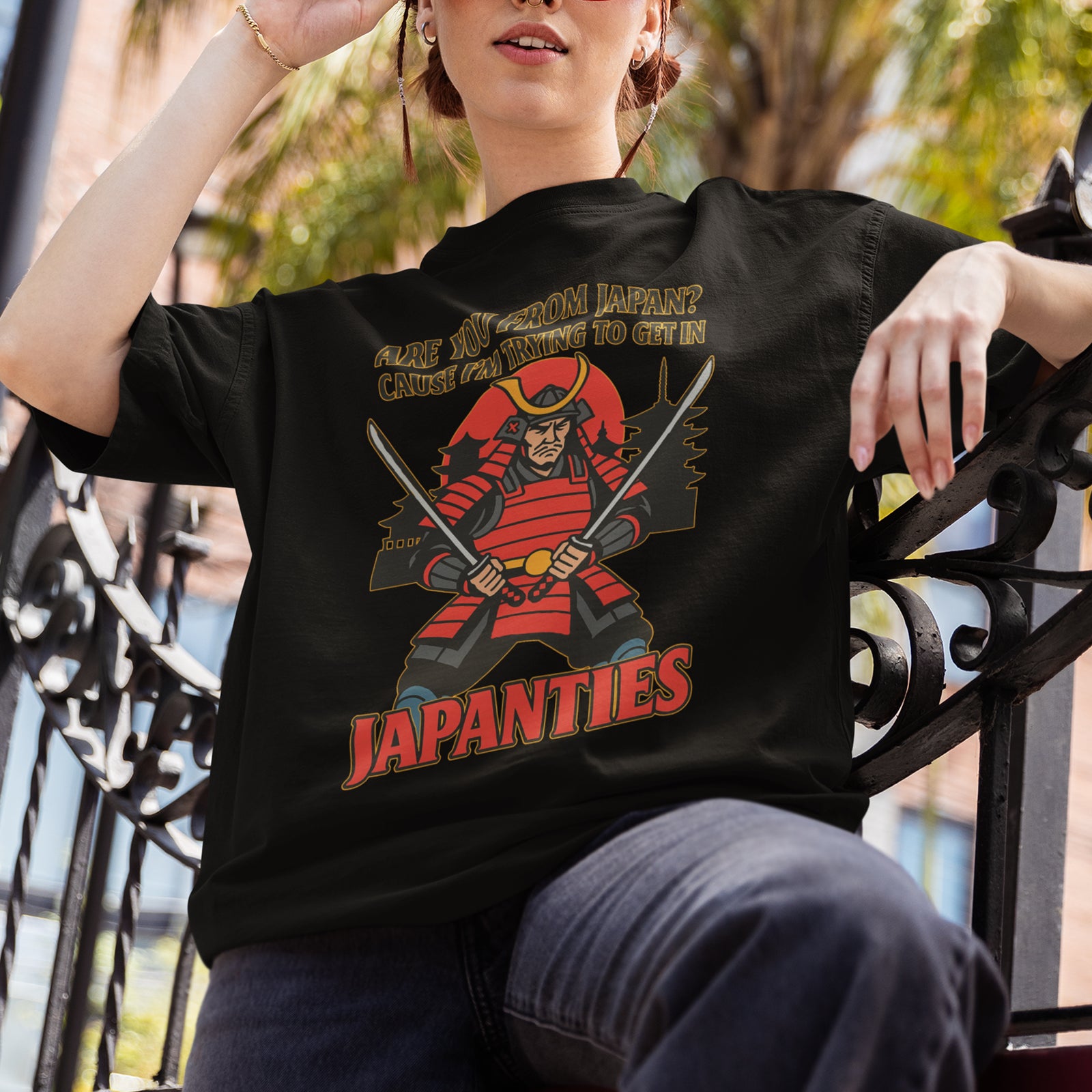 Model wearing an Orbital Clothing black t-shirt featuring funny pick up line graphic text Are you from Japan? Cause I'm trying to get in Japanties