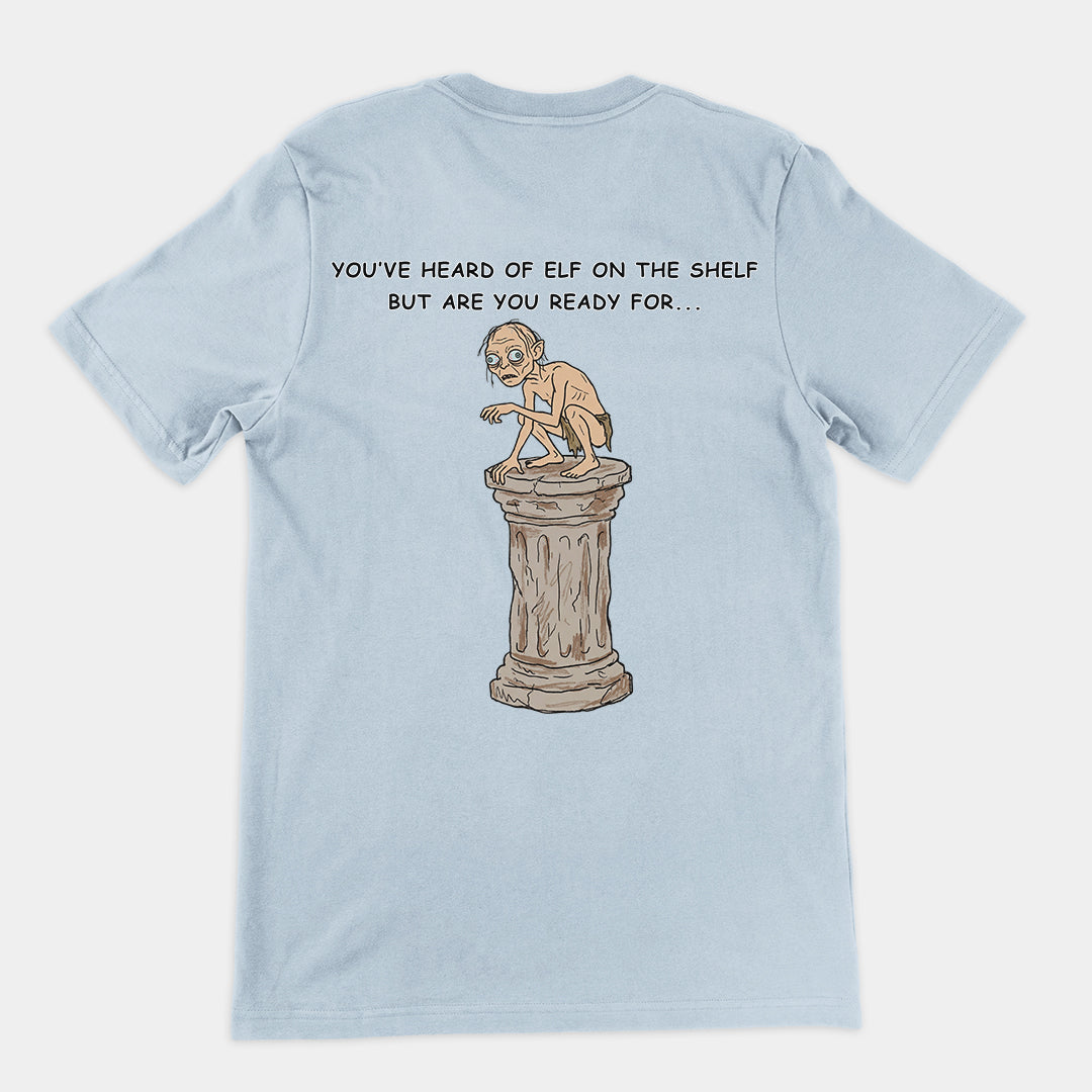 You've heard of elf on the shelf but are you ready for Gollum on a Collumn T-Shirt (backprint) Orbital Clothing