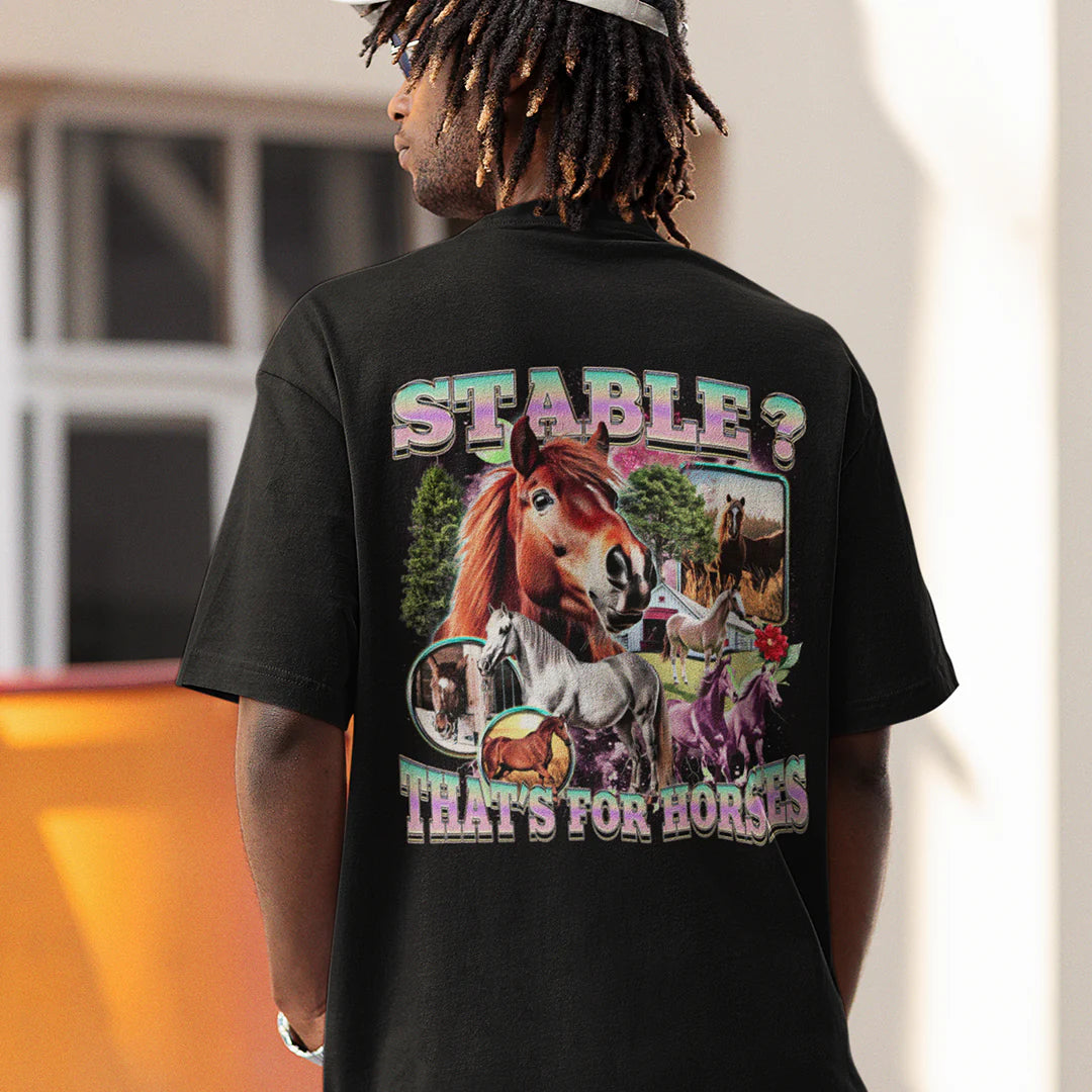 Back view of a model wearing a funny graphic tee with a retro collage of horses and the ironic text STABLE? THAT'S FOR HORSES.