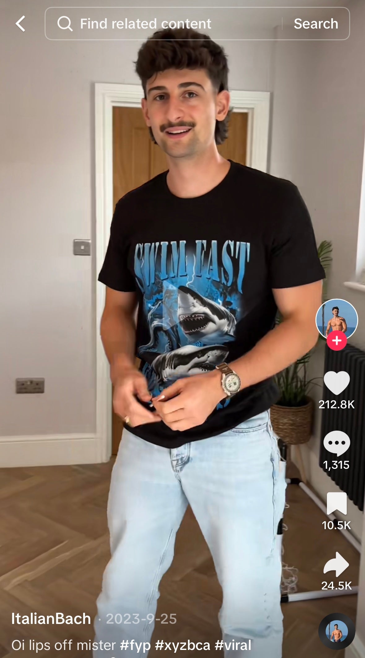 Man wearing a black graphic t-shirt with aggressive sharks, lightning, and the ironic text SWIM FAST.