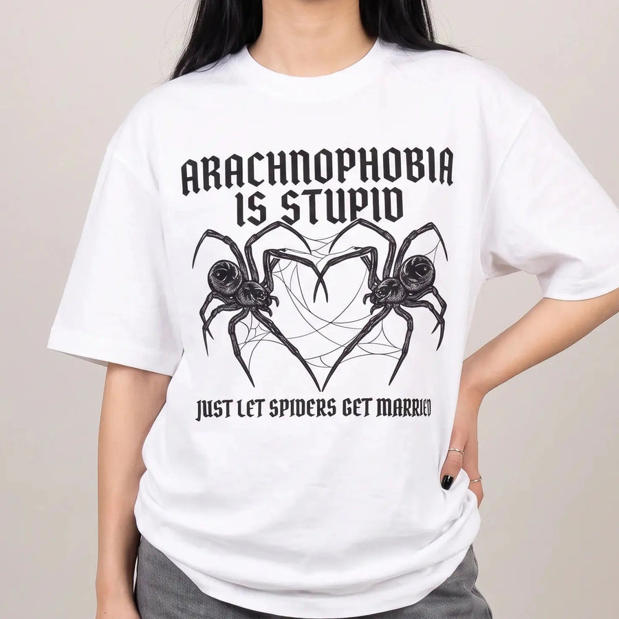 Model wearing the Arachnophobia is stupid just lets spiders get married T-Shirt in white, studio photo