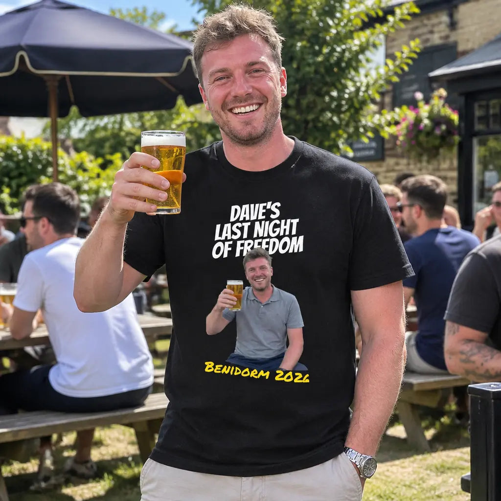 Man in a beer garden wearing a custom stag do t-shirt with the groom's photo, made with the Orbital design your own t-shirt maker
