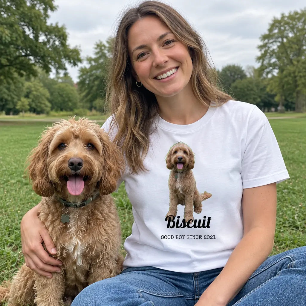 Woman in a park with her cockapoo wearing a custom white t-shirt printed with the dog's photo and name
