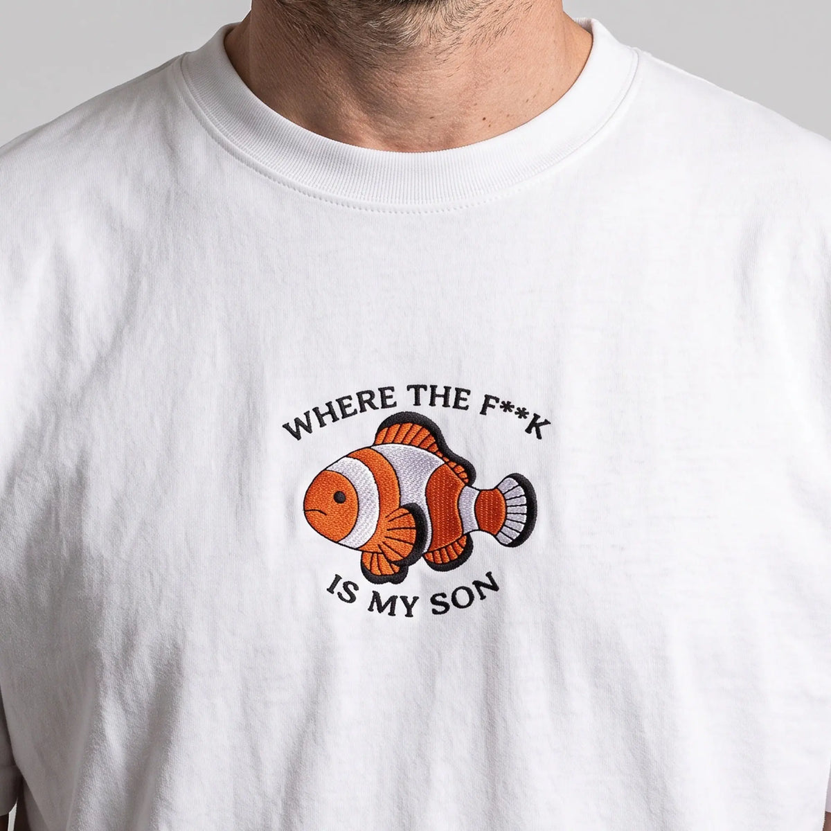Where the f**k is my son embroidered clownfish t-shirt in white, worn, close-up of the stitching