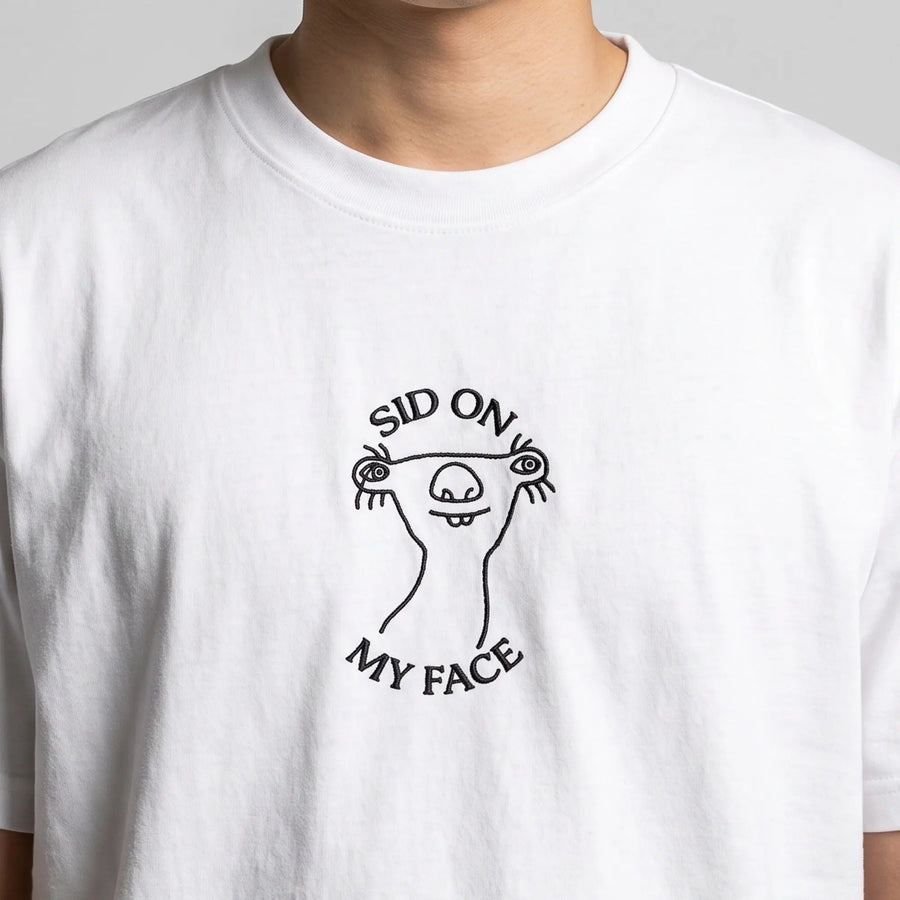 Sid on my face embroidered t-shirt in white, worn, close-up of the stitching