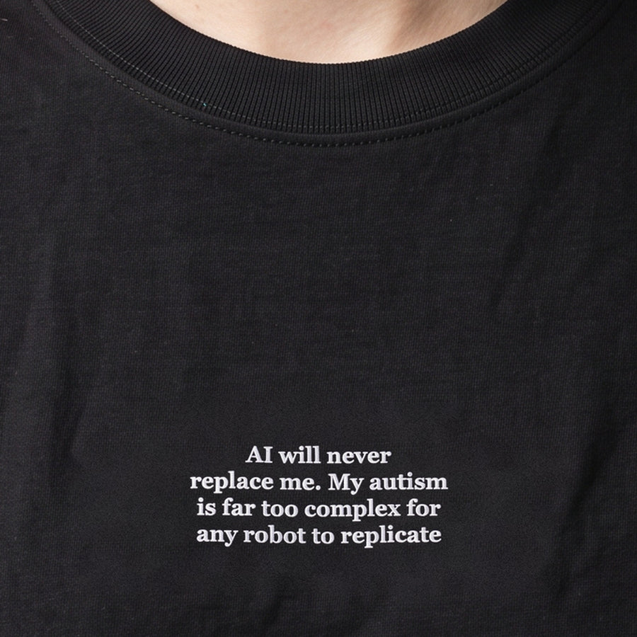 AI will never replace me. My autism is far too complex for any robot to replicate (embroidered) T-Shirt in black, worn, close-up of the stitching