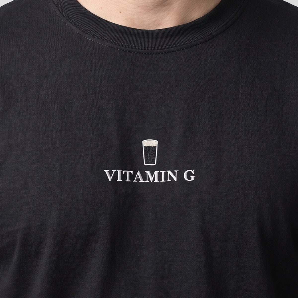 Vitamin G (embroidered) T-Shirt in black, worn, close-up of the stitching
