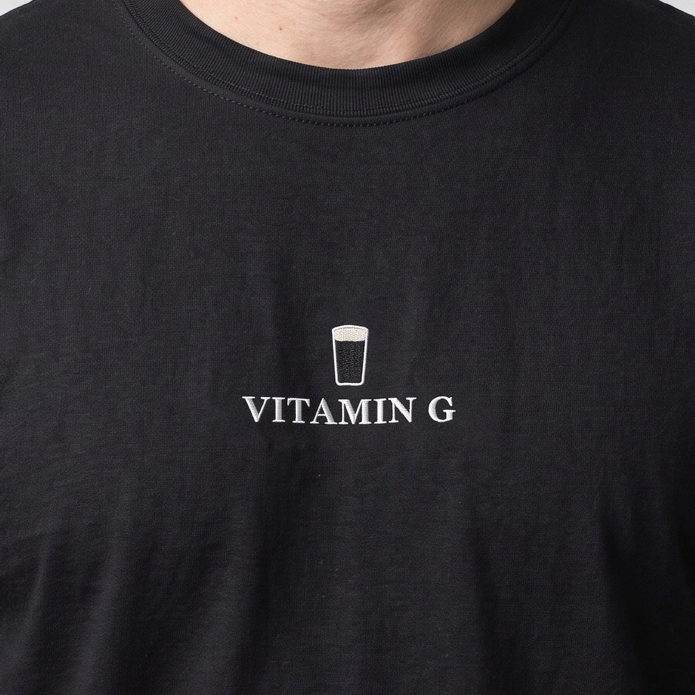 Vitamin G (embroidered) T-Shirt in black, worn, close-up of the stitching