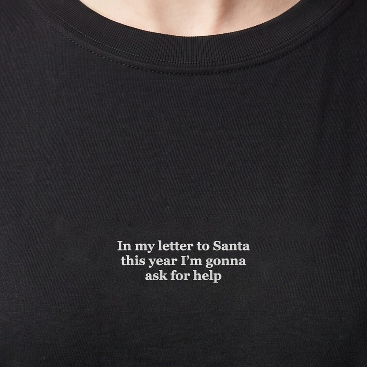In my letter to Santa this year I'm gonna ask for help (embroidered) T-Shirt in black, worn, close-up of the stitching