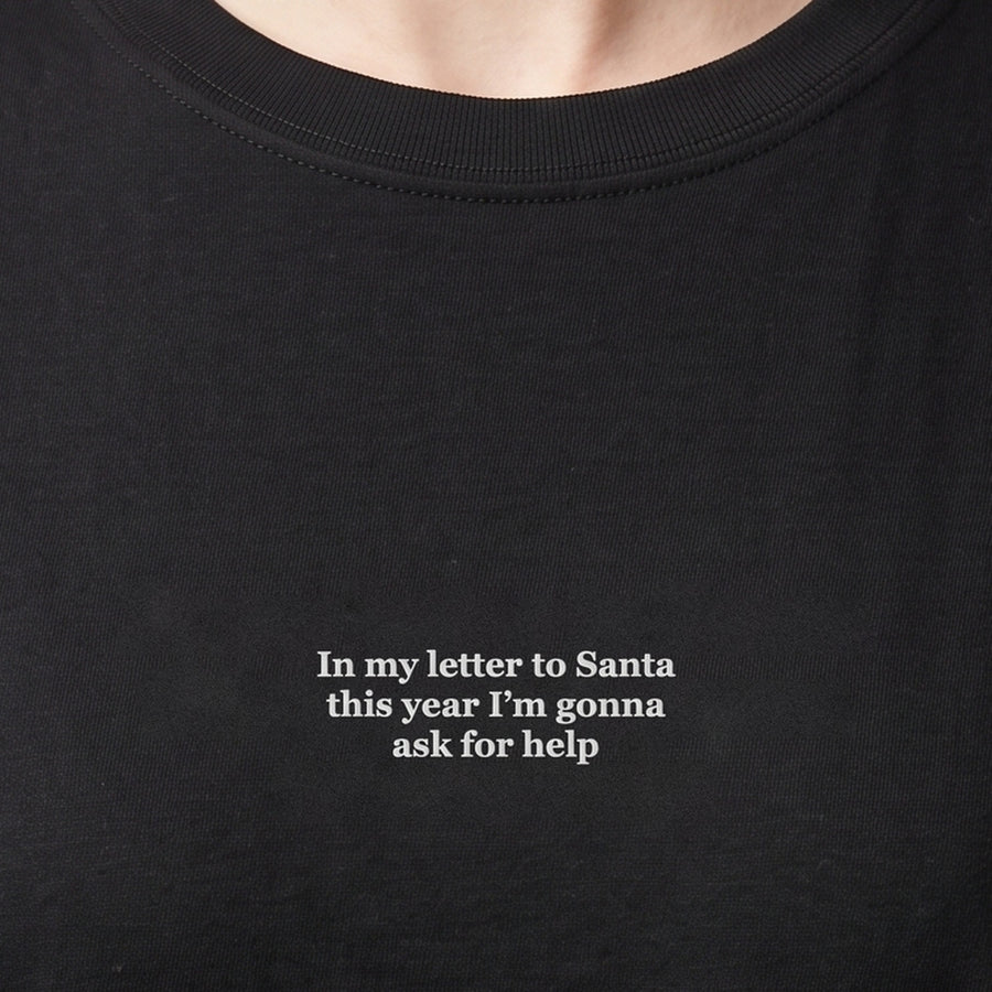 In my letter to Santa this year I'm gonna ask for help (embroidered) T-Shirt in black, worn, close-up of the stitching