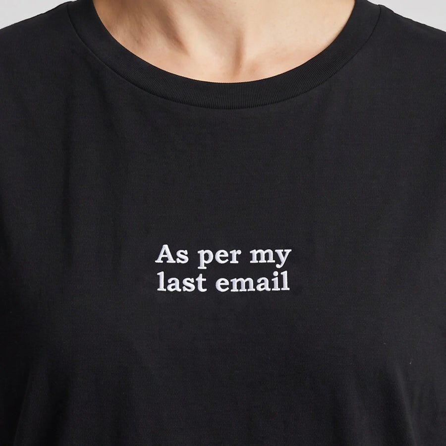 As per my last email embroidered t-shirt in black, worn, close-up of the stitching