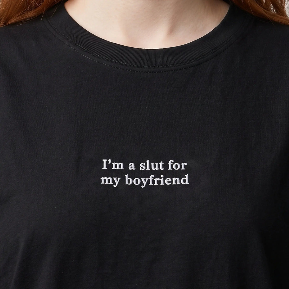 I'm a slut for my boyfriend embroidered t-shirt in black, worn, close-up of the stitching