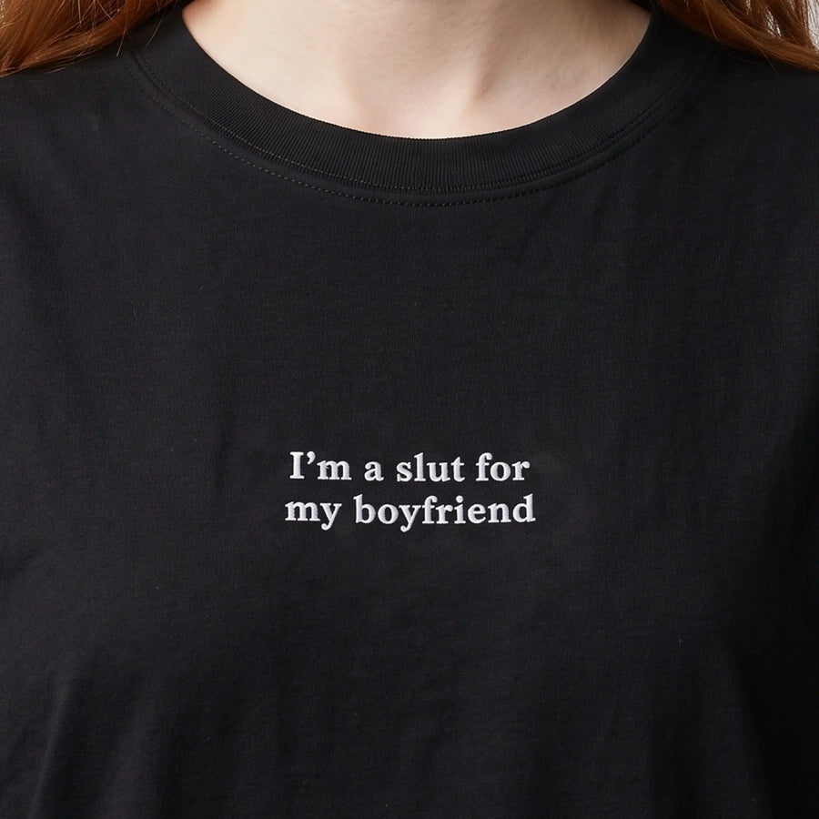 I'm a slut for my boyfriend embroidered t-shirt in black, worn, close-up of the stitching