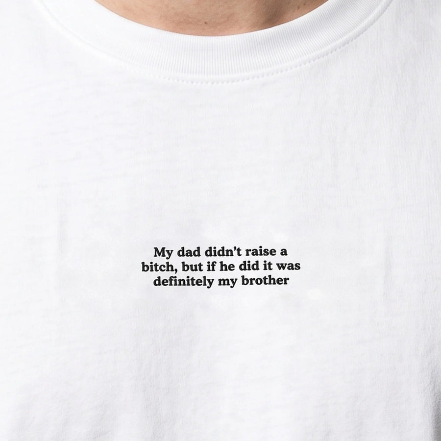 My dad didn't raise a bitch but if he did it was definitely my brother embroidered t-shirt in white, worn, close-up of the stitching