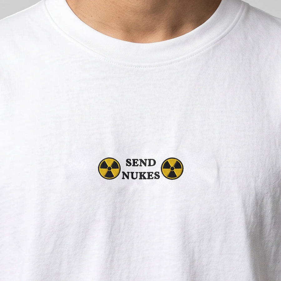 Send Nukes (embroidered) T-Shirt in White, worn, close-up of the stitching