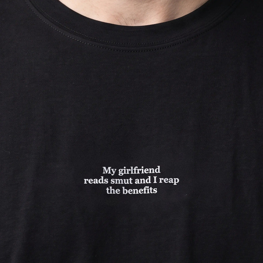 My girlfriend reads smut and I reap the benefits embroidered t-shirt, worn, close-up of the stitching