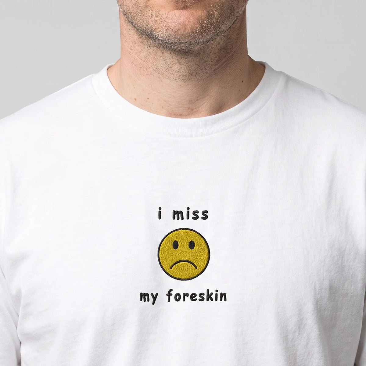 I miss my foreskin (embroidered) T-Shirt in White, worn, close-up of the stitching