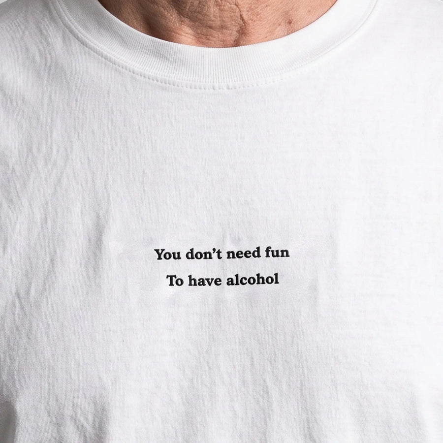 You don't need fun to have alcohol (Embroidered) T-Shirt in White, worn, close-up of the stitching