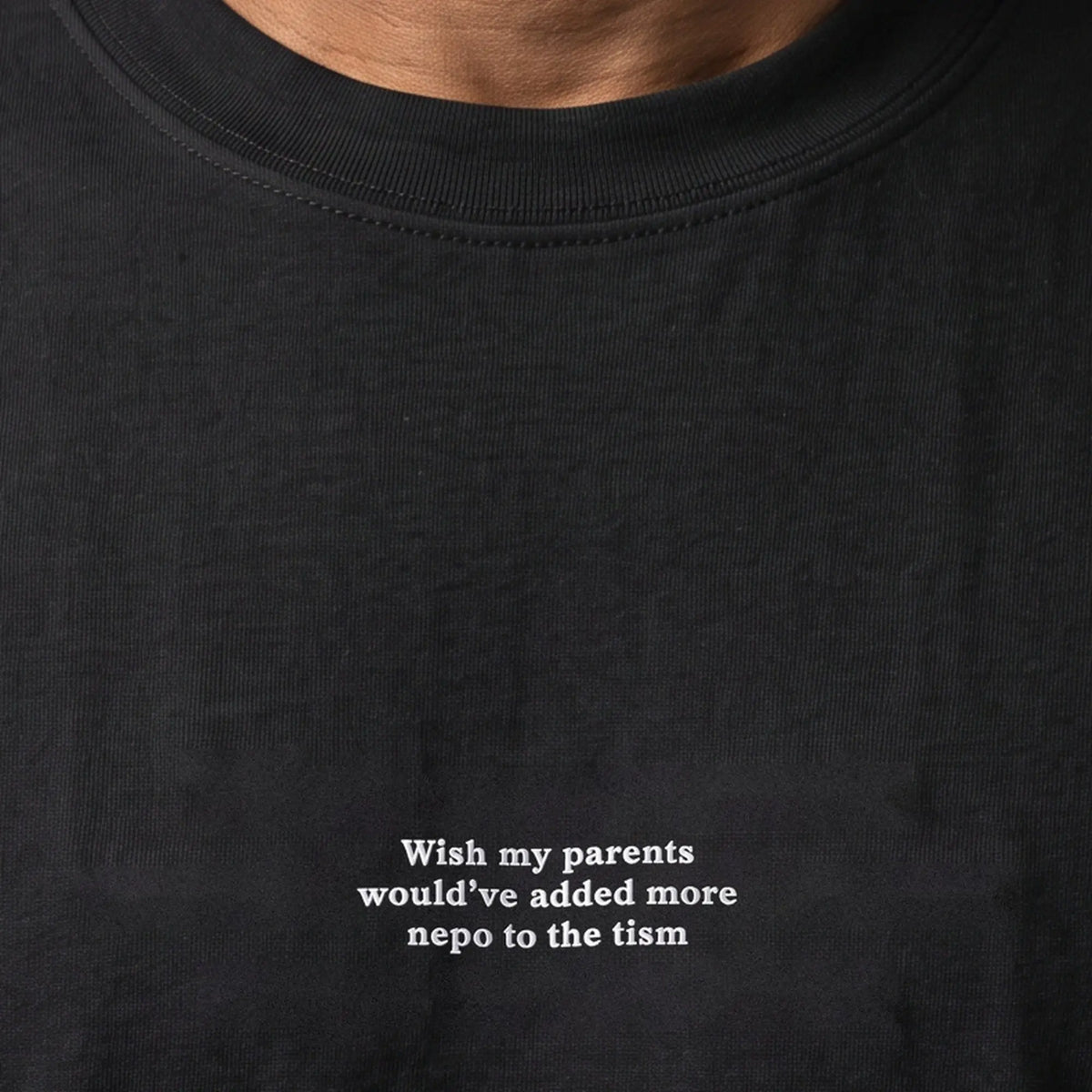 Wish my parents would've added more nepo to the tism embroidered t-shirt, worn, close-up of the stitching