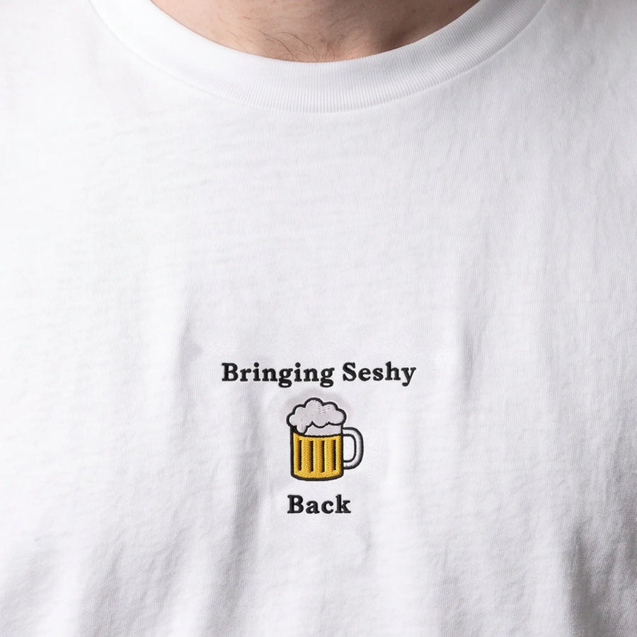 Bringing seshy back embroidered t-shirt, worn, close-up of the stitching