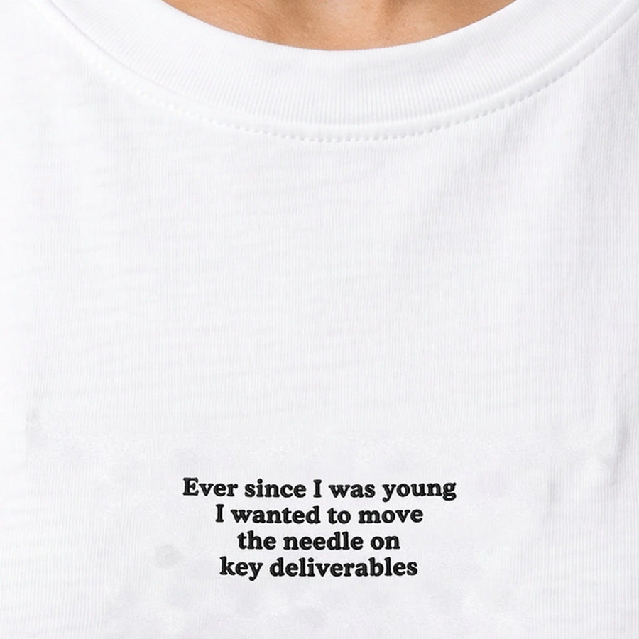 Ever since I was young I wanted to move the needle on key deliverables embroidered t-shirt in white, worn, close-up of the stitching
