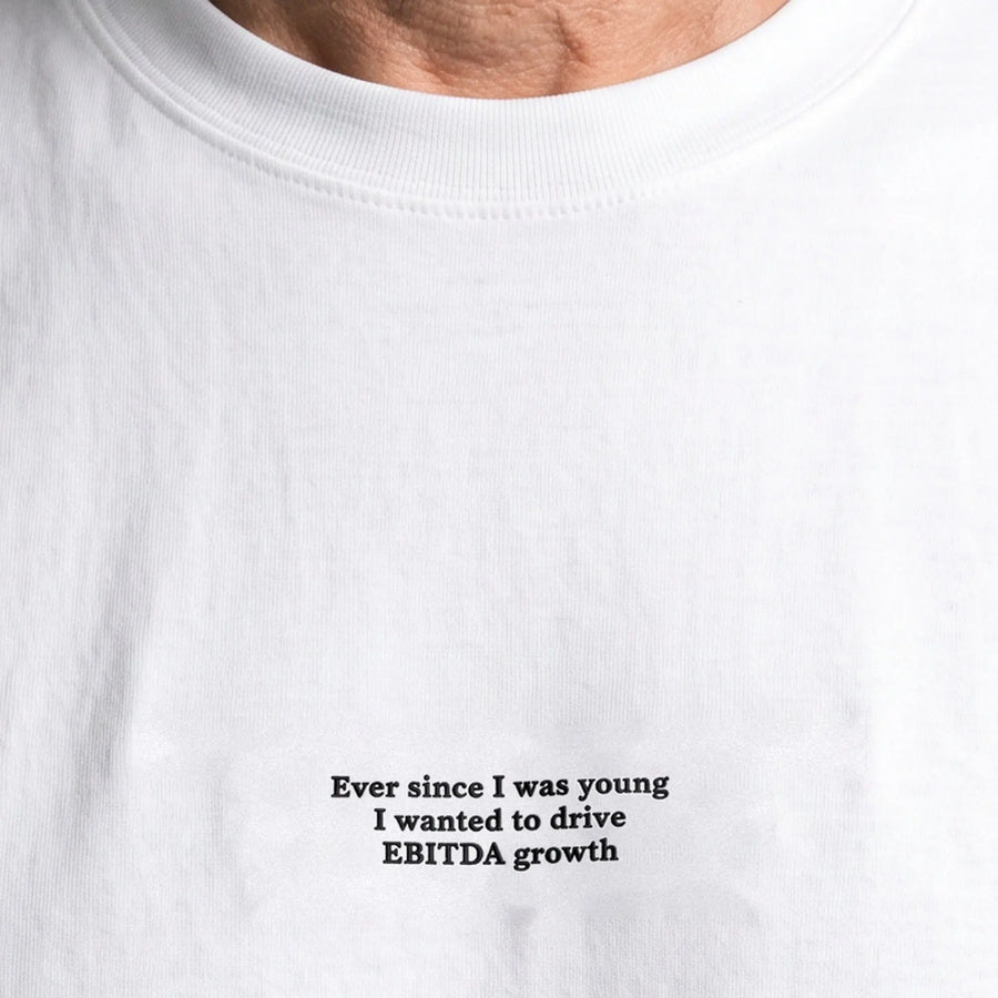 Ever since I was young I wanted to drive EBITDA growth embroidered t-shirt, worn, close-up of the stitching