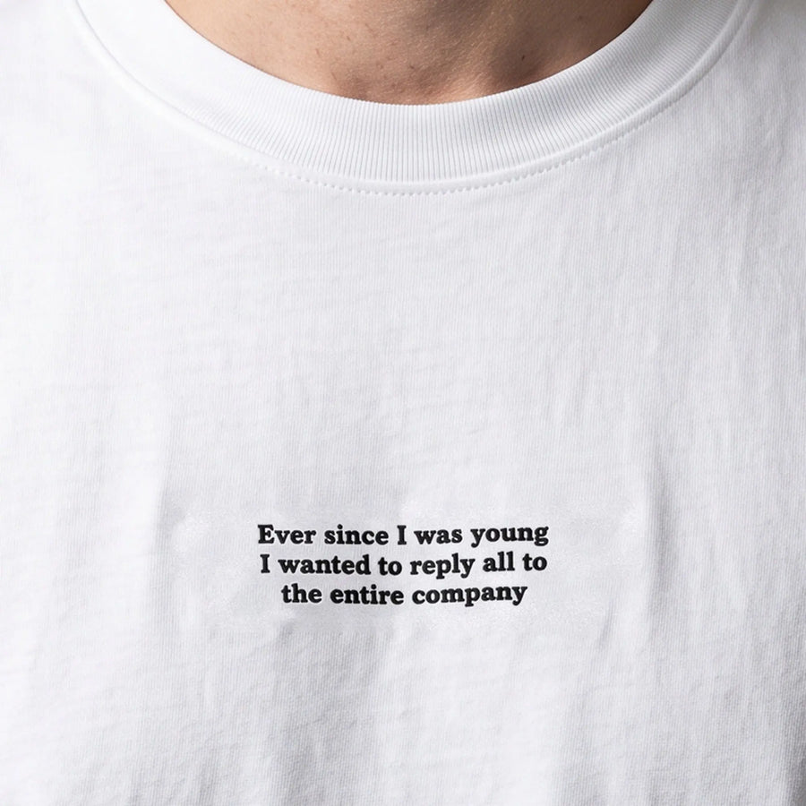 Ever since I was young I wanted to reply all to the entire company (embroidered) T-Shirt in white, worn, close-up of the stitching