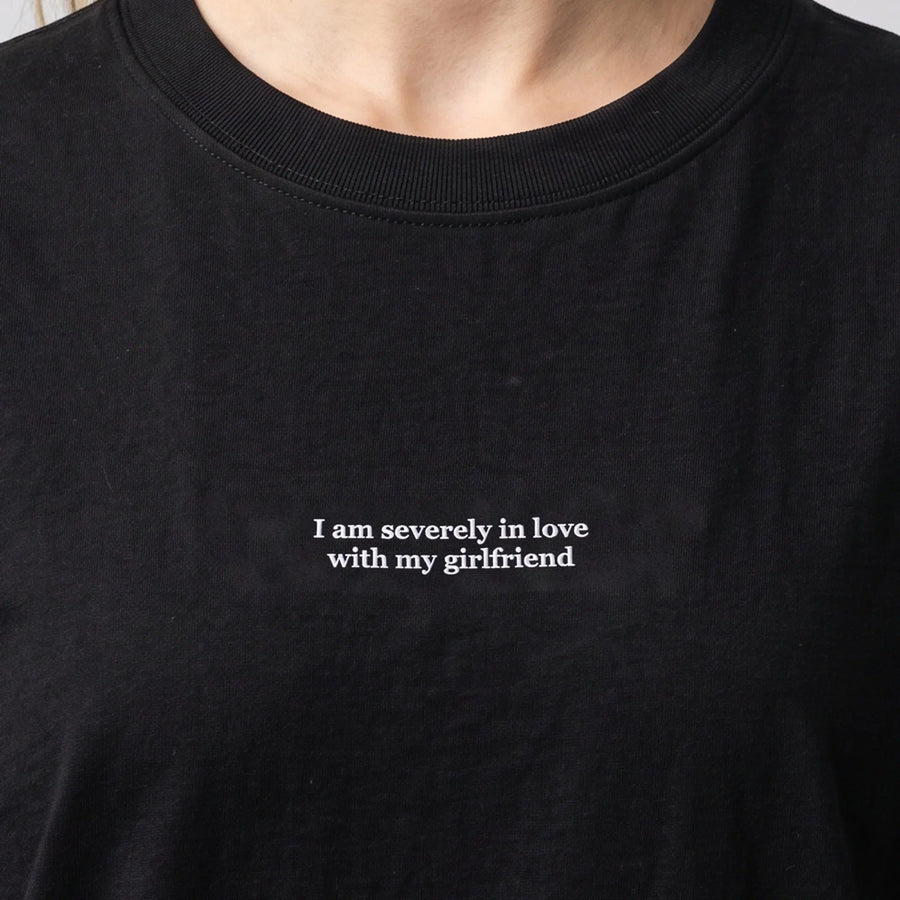 I am severely in love with my girlfriend (embroidered) T-Shirt in black, worn, close-up of the stitching