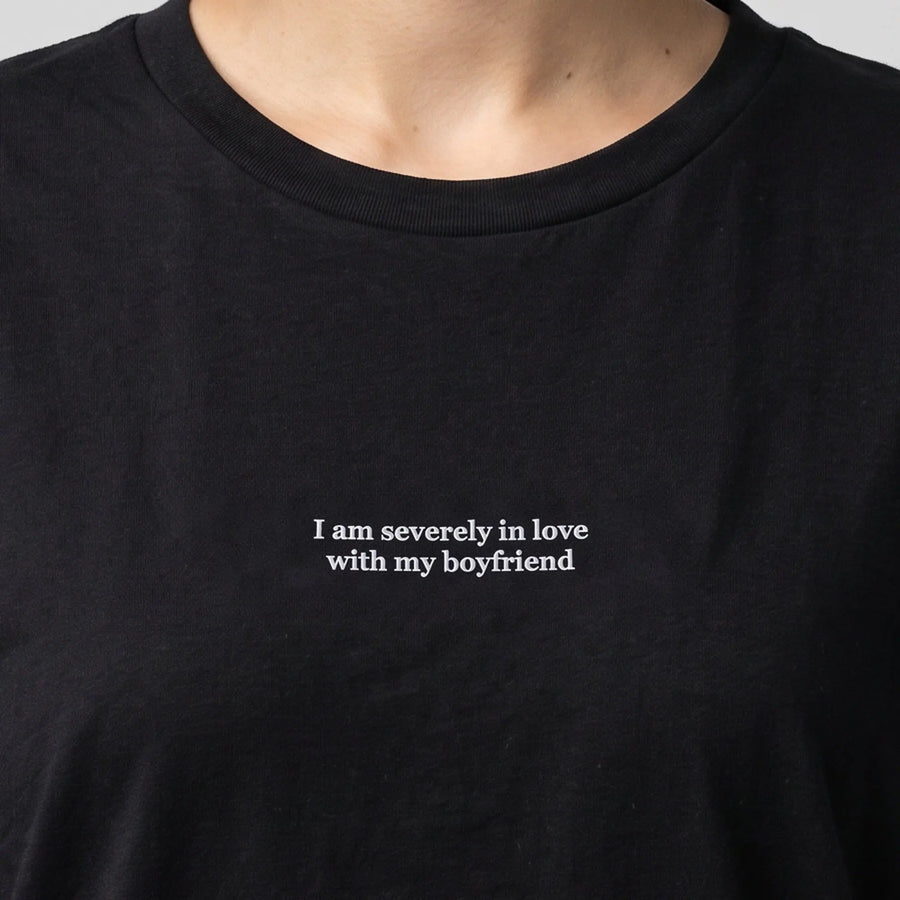 I am severely in love with my boyfriend (embroidered) T-Shirt in black, worn, close-up of the stitching
