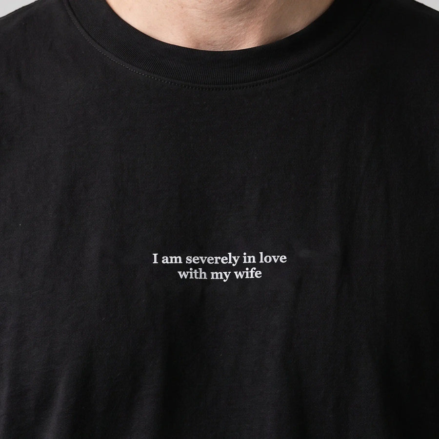 I am severely in love with my wife (embroidered) T-Shirt in black, worn, close-up of the stitching