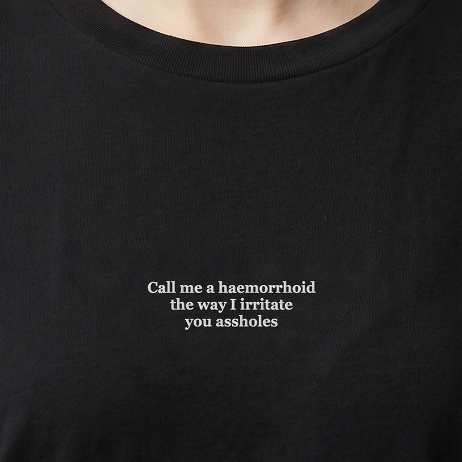 Call me a haemorrhoid the way I irritate you assholes (embroidered) T-Shirt in Black, worn, close-up of the stitching