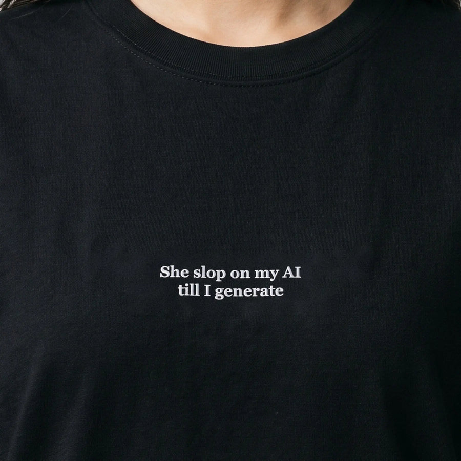 She slop on my AI till I generate (embroidered) T-Shirt in Black, worn, close-up of the stitching