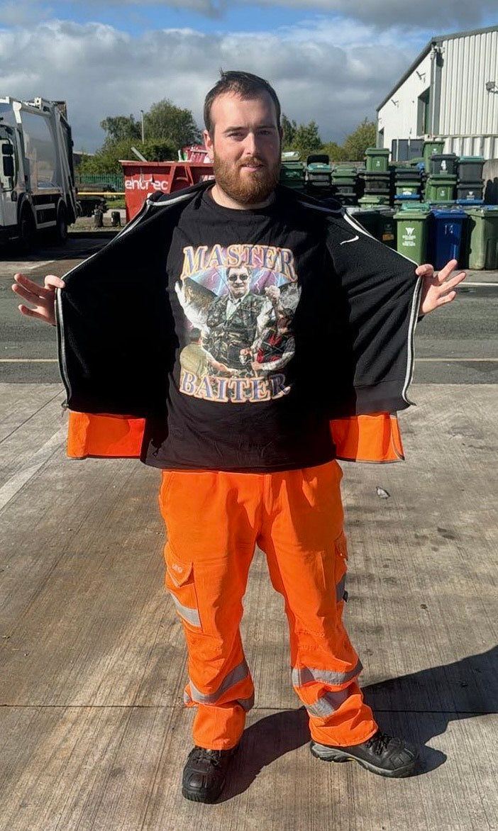 Customer wearing high-visibility work pants showing off the MASTER BAITER fishing graphic t-shirt.