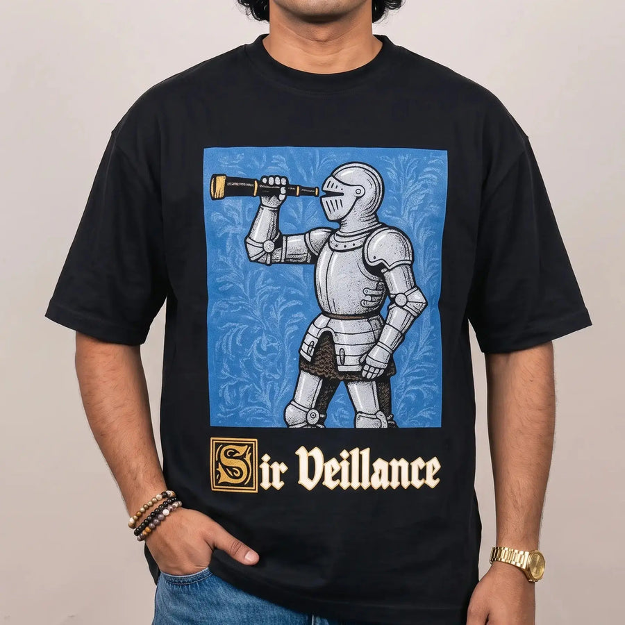 Model wearing the Sir Veillance Handdrawn Funny T-Shirt in black, studio photo