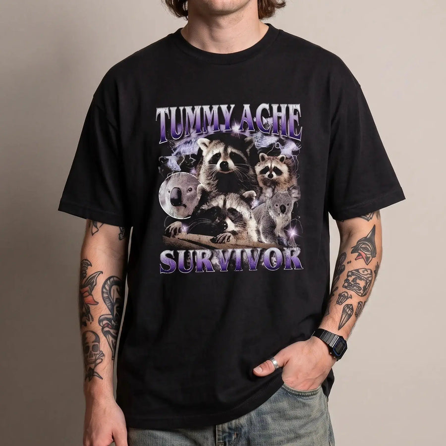 Model wearing the Tummy Ache Survivor Banter t-shirt in black, studio photo