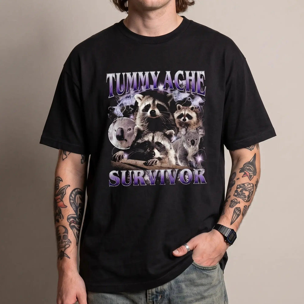 Model wearing the Tummy Ache Survivor Banter t-shirt in black, studio photo