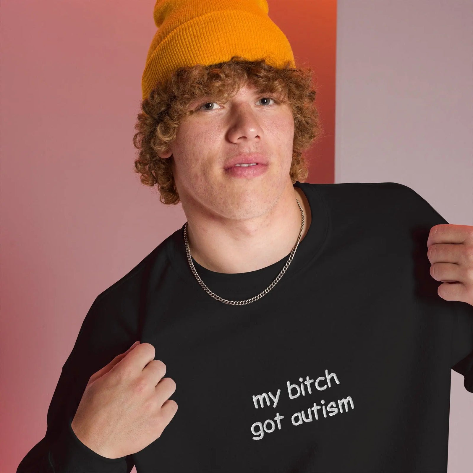 Model wearing an Orbital Clothing black embroidered sweatshirt featuring graphic text My Bitch Got Autism funny meme